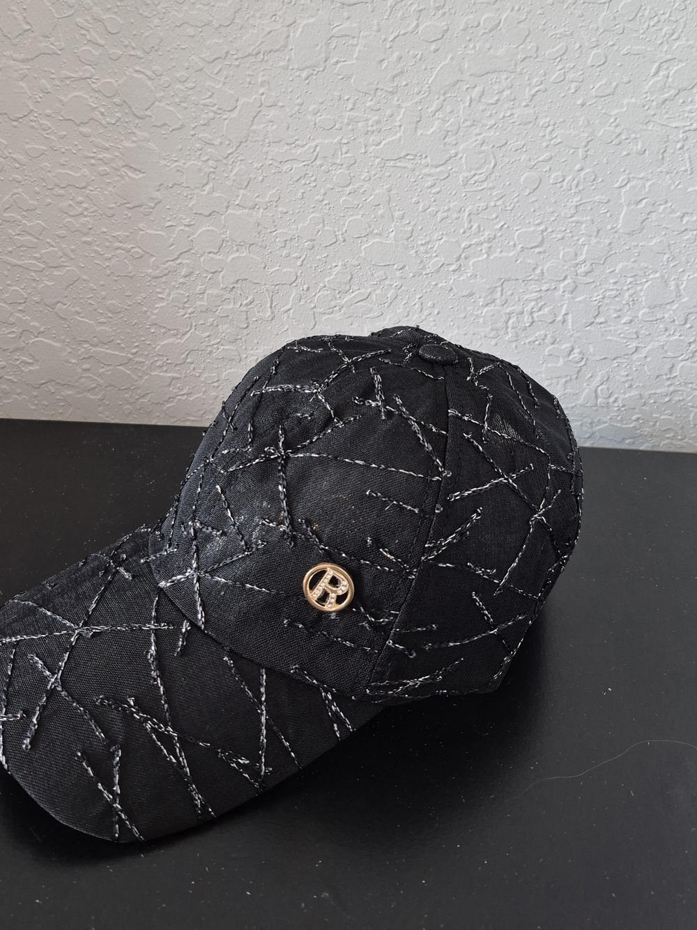 Black Quilted Baseball Cap with Gold Emblem